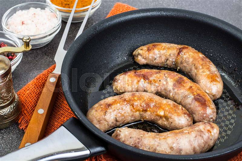 Sausage home pork, fried in frying pan. Studio Photo , stock photo