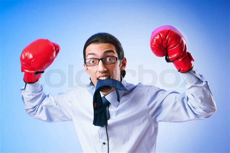 Businessman with boxing gloves, stock photo