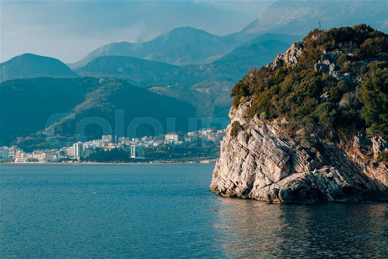 Rock near the beach of the Queen, near the island of Sveti Stefan and Villa Milocer, Montenegro, stock photo