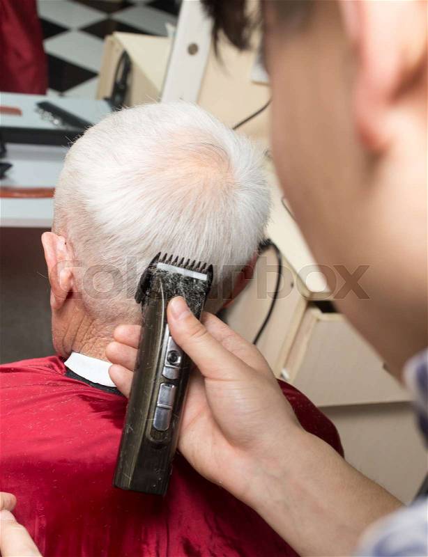 Man\'s haircut trimmer in the beauty salon , stock photo