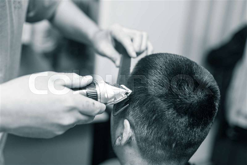 Man\'s haircut trimmer in the beauty salon , stock photo