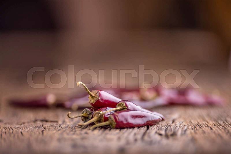 Chili.Red chili peppers on wooden table. Selective focus, stock photo