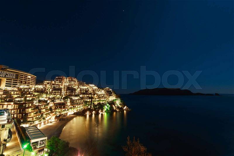 Hotel complex for rich people Dukley Gardens in Budva, Montenegro. Night photo at the full moon, starry sky, stock photo