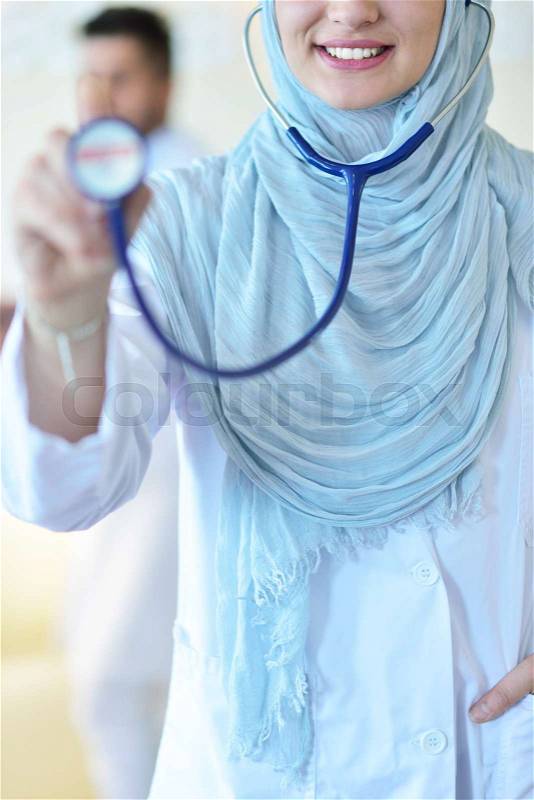 Confident Muslim medical student pose at hospital, stock photo