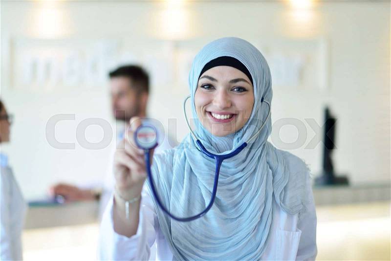 Confident Muslim medical student pose at hospital, stock photo