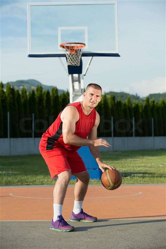 Portrait of young man street basket player, stock photo