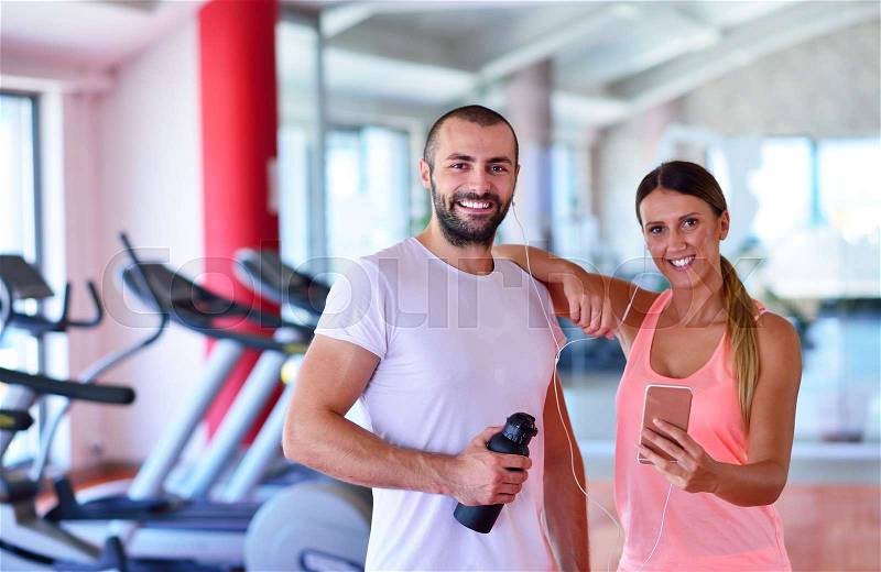Young couple taking a sefie in a gym, stock photo