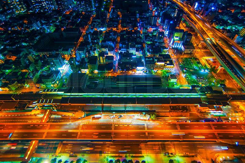 The image of the night city from the height of a bird\'s flight.A view of the night Osaka.Mnogo houses in iluminatsii.Dark time of the day, stock photo