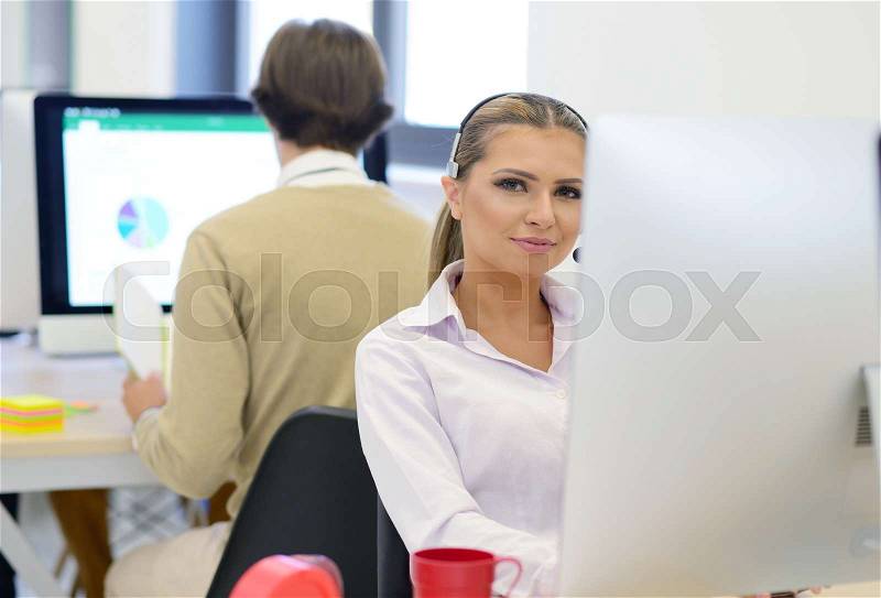 Startup business, young beautiful woman as software developer working on computer at modern office, stock photo