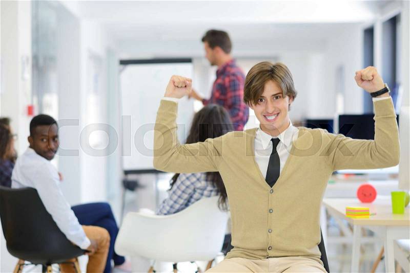 Business, startup and people concept - happy creative team talking in office, stock photo