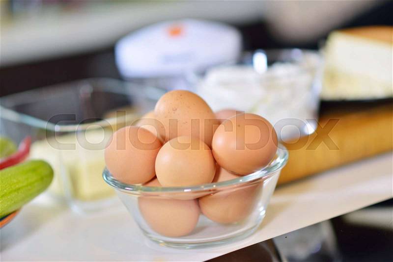 Kitchen table with eggs on basket, focus from top view kitchen table, stock photo