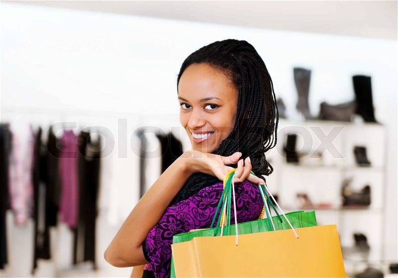 Latin american women with packages shopping, stock photo