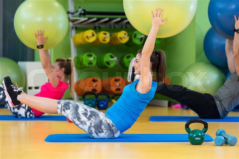 Group of people in a Pilates class at the gym, stock photo