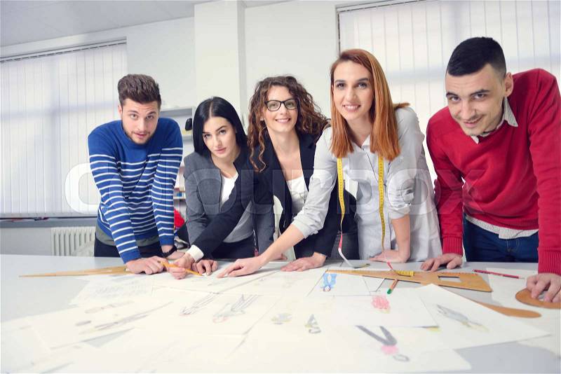 Fashion students working as a team at the college, stock photo