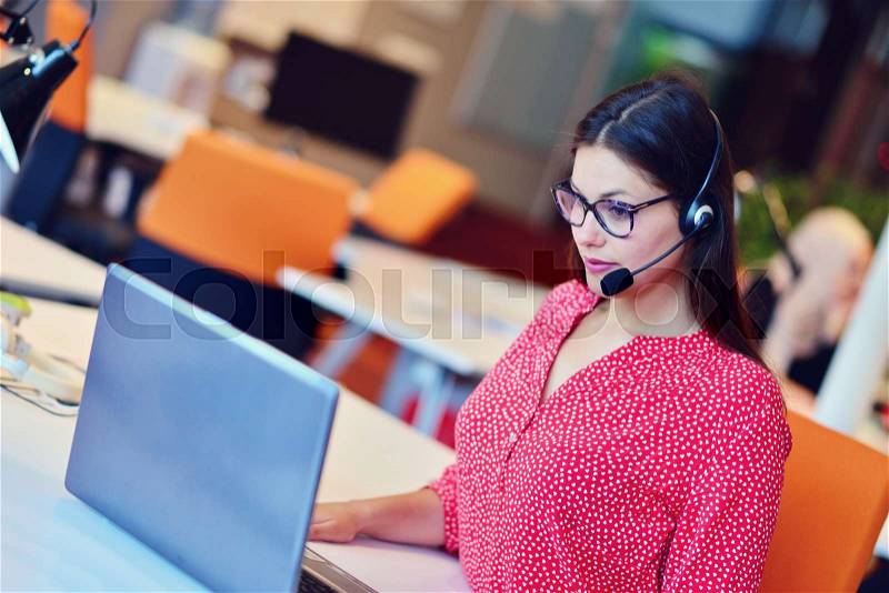 Beautifull Young female in call center team, stock photo
