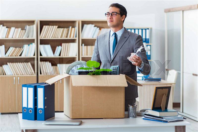 Man moving office with box and his belongings, stock photo