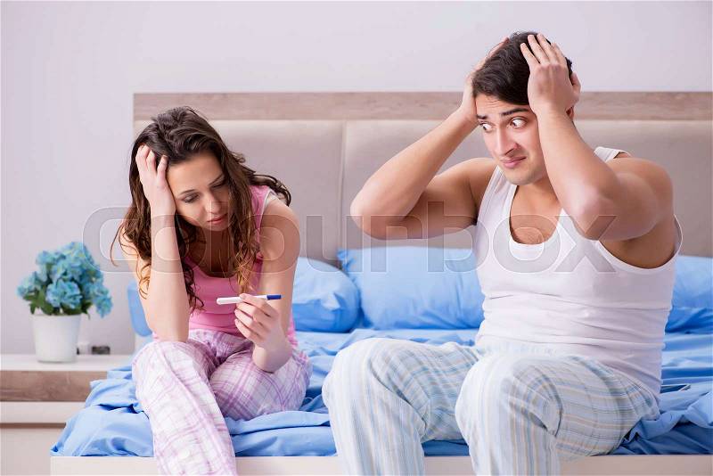 Man husband upset about pregnancy test results, stock photo