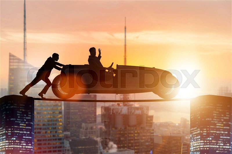 Teamwork concept with businessman pushing car, stock photo