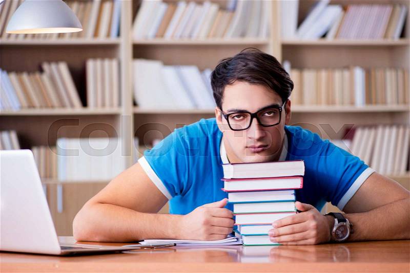 Young student preparing for school exams, stock photo
