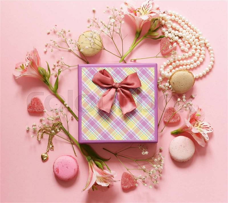 Gift box with jewelry, flowers and macaroons, stock photo