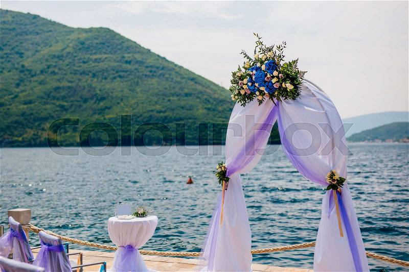 Arch for the wedding ceremony on the sea, stock photo