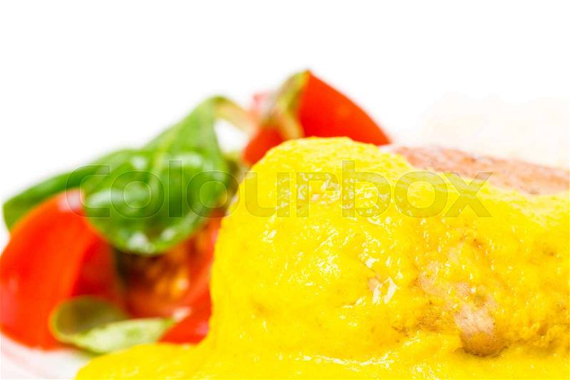 Roasted chicken fillet with rice and fresh vegetables as a garnish. Served with delicious saffron mousse. Macro. Photo can be used as a whole background, stock photo