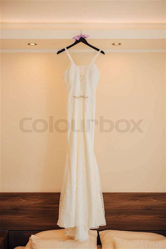 The bride\'s dress on a hanger in the room in Montenegro, stock photo