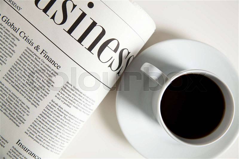 Coffee cup and newspaper, high angle view, stock photo