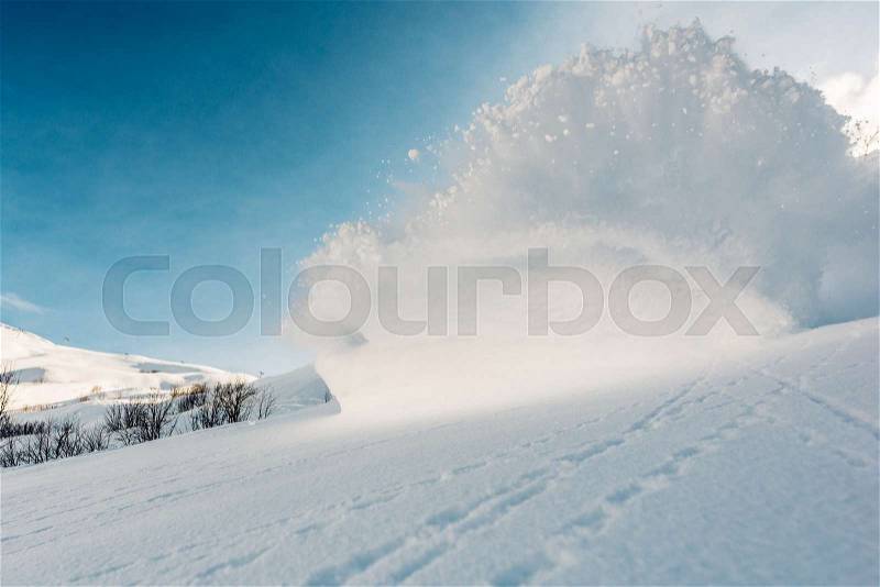 Big snow explosion on the mountain hill, stock photo