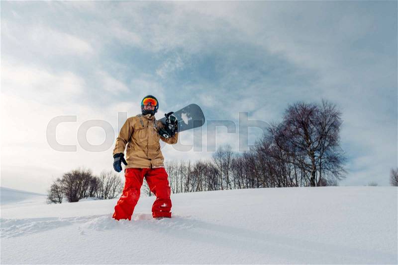 Sportsman stay and watch beautiful view with sowboard equpment, stock photo