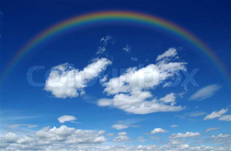 A bright rainbow in the sky, stock photo