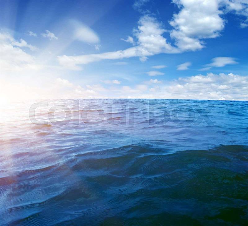 Blue sea and sun on sky, stock photo