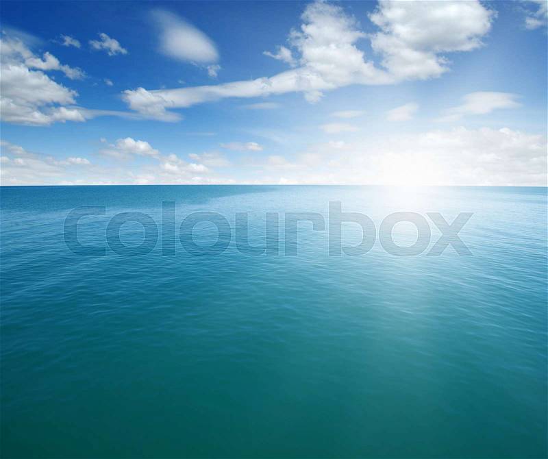 Blue sea and sun on sky, stock photo