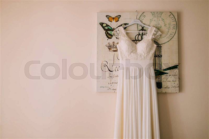 The bride\'s dress on a hanger in the room in Montenegro, stock photo