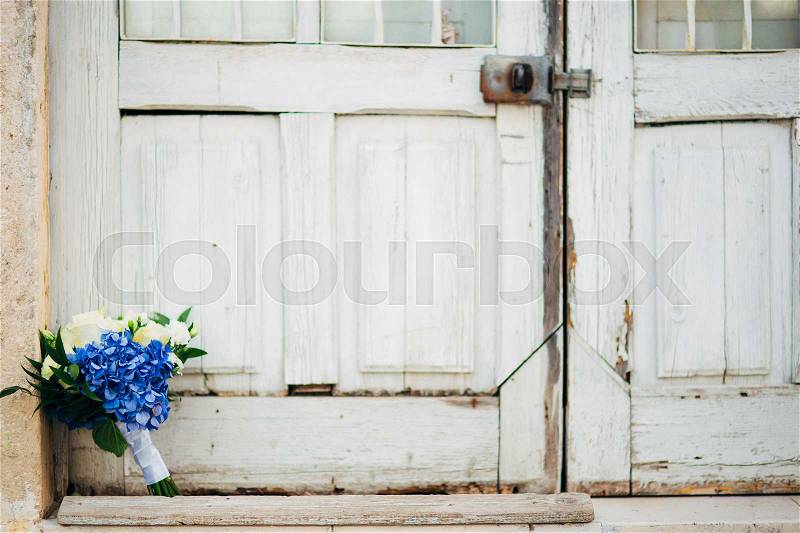 Wedding bouquet on textural background. Wedding in Montenegro, stock photo