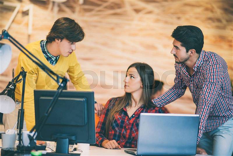 Startup business people group working as team to find solution to problem, stock photo