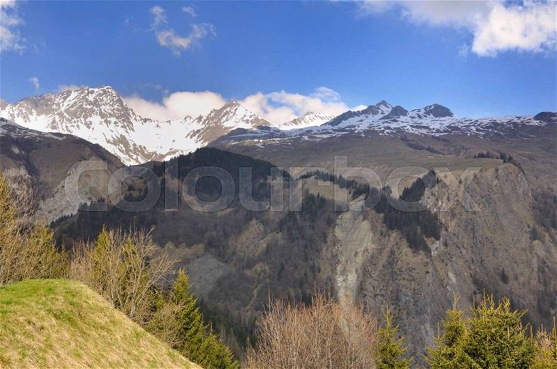 Lanscape mountain in spring with snowy summet , stock photo