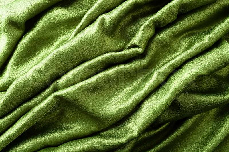 Smooth elegant green satin or silk .Cloth texture can use as background. Luxurious background design. , stock photo