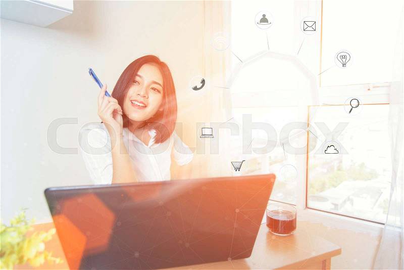 Business woman holding smart phone with icon flow.Communication network digital 4.0 technology.Internet wireless application development mobile and smartphone apps computing.Online E-commerce concept, stock photo