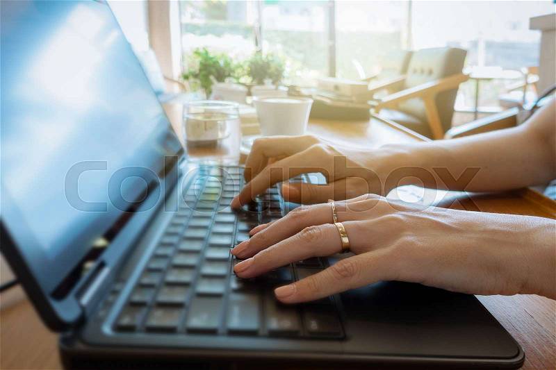 Hand on keyboard close up, business woman working on laptop in home office as agile technology concept, stock photo