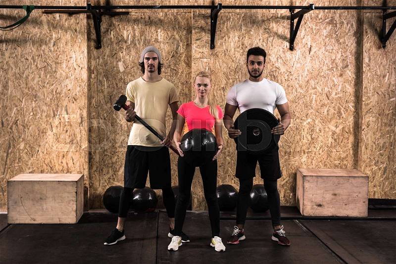 Sport Fitness People Group Crossfit Training Equipment, Young Healthy Man And Woman Gym Interior Doing Exercises, Full Length Portrait, stock photo