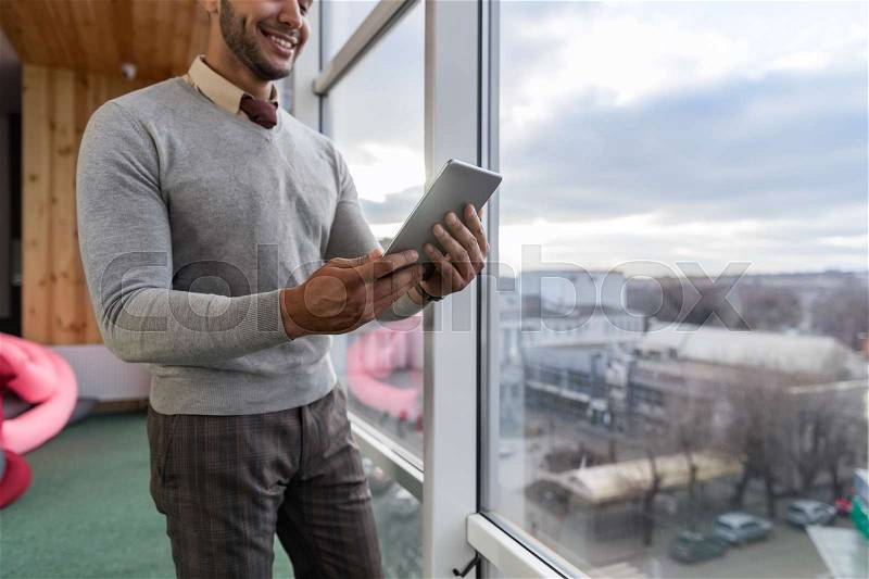 Hispanic Business Man Using Tablet Computer Stand In Front Panoramic Window Happy Smiling Businessman Coworking Center Office Interior, stock photo