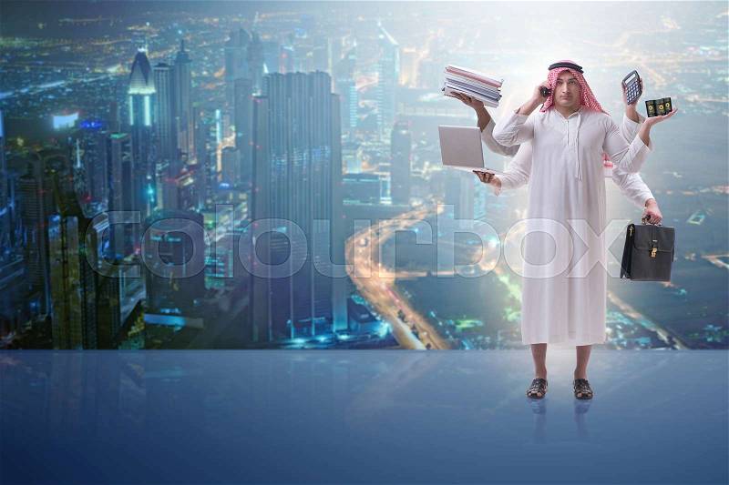 Arab businessman in multitasking concept, stock photo