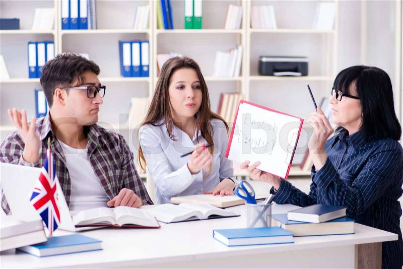 Young foreign student during english language lesson, stock photo