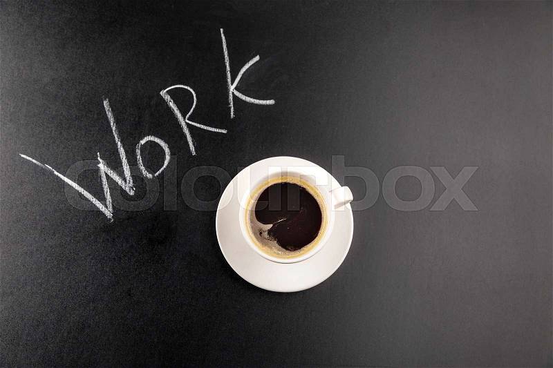 Top view of coffee mug steam and Work lettering isolated on black, stock photo