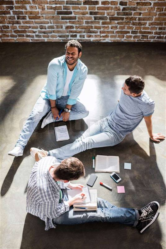 Overhead view of small office meeting in small business office, stock photo