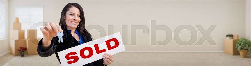 Banner of Hispanic Woman Inside Room with Boxes Holding House Keys and Sold For Sale Real Estate Sign, stock photo