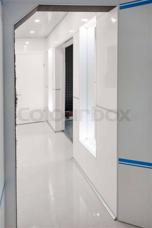 Modern home hallway interior. White plactic panels and tiles. Futuristic interior concept design. Space ship at home, stock photo