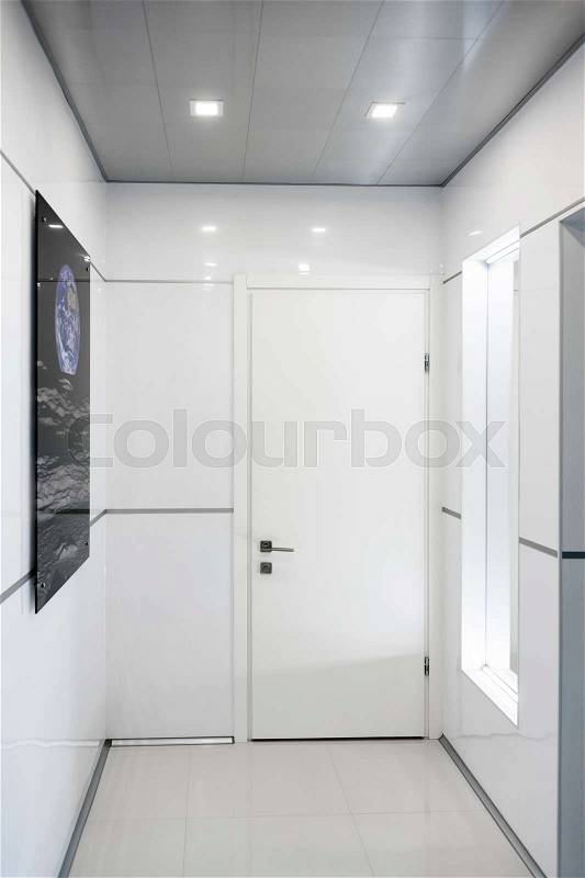 Modern home hallway interior. White plactic panels and tiles. Futuristic interior concept design. Space ship at home. Elements of this image furnished by NASA, stock photo