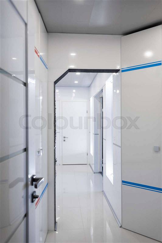 Modern home hallway interior. White plactic panels and tiles. Futuristic interior concept design. Space ship at home, stock photo